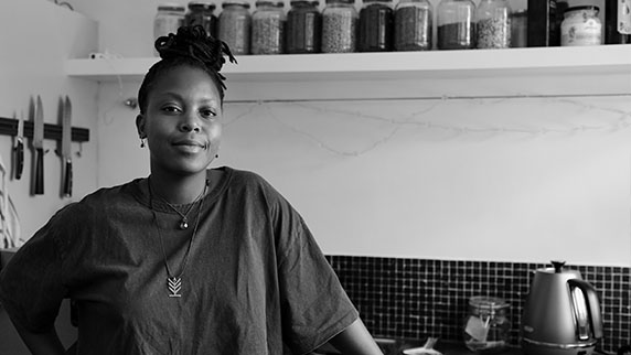 Lady standing in the kitchen