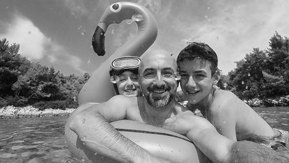 Family on inflatable flamingo