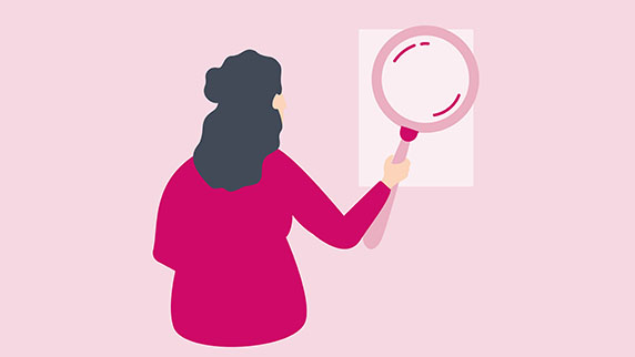 Woman with giant magnifying glass