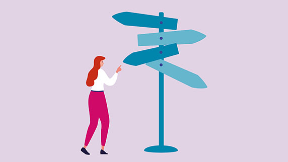 Woman in front of signpost